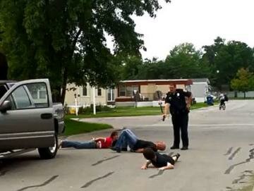 Cop Caught on Video Forcing Family of Three to Lie in the Road at Gunpoint After Minor Traffic Dispute Cop Caught on Video Forcing Family of Three to Lie in the Road at Gunpoint After Minor Traffic Dispute
